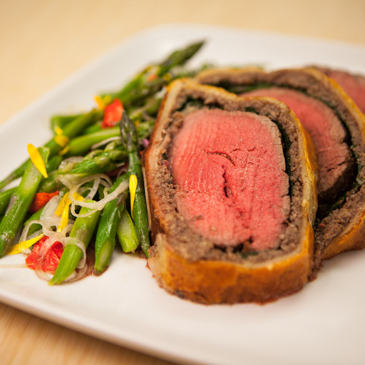 Beef Wellington dish representing a holiday cooking class event by Legacy Partners Insurance Agency